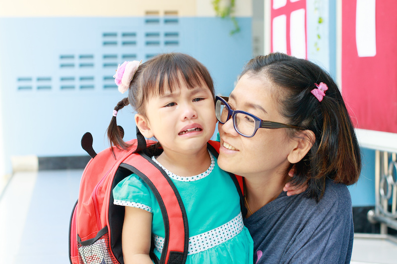children and mother crying first day go to pre-kindergarten school